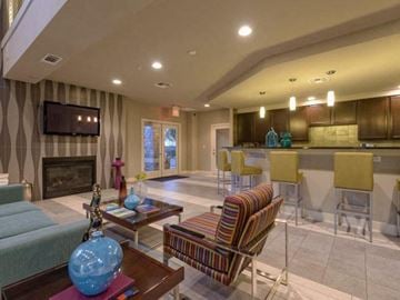 Mckinney apartment for rent - a living room and a kitchen with a table and chairs