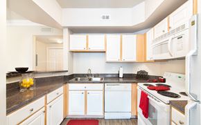 Houston apartment for rent - a kitchen with white appliances and white cabinets