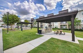 Houston apartment for rent - a picnic area with a picnic table and a pavilion