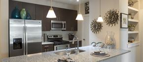 Greenville apartment for rent - a kitchen with stainless steel appliances and granite counter tops