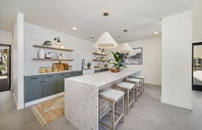 Scottsdale apartment for rent - a kitchen with a long counter and stools in a house