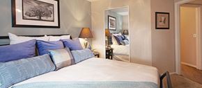 Scottsdale apartment for rent - a bedroom with a bed and a door to a bathroom