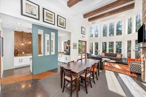 Phoenix apartment for rent - A dining room with a long table and chairs.