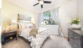Phoenix apartment for rent - a bedroom with a bed and a ceiling fan