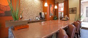 Gilbert apartment for rent - a kitchen with a long counter and chairs