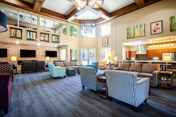 Scottsdale apartment for rent - a large living room with couches and chairs and a fireplace