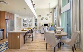 Tempe apartment for rent - A modern kitchen with a dining table and chairs.