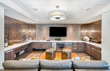 Tempe apartment for rent - a kitchen and living room with a couch and a tv