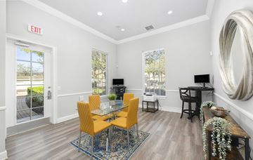 Sanford apartment for rent - A dining room with a glass table and chairs.