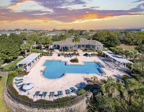 Sanford apartment for rent - A large house with a pool in the backyard.