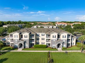 Sanford apartment for rent - an aerial view of an apartment building with green grass and trees