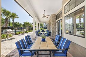 Gainesville apartment for rent - an outdoor dining area with a table and chairs