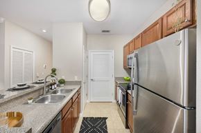 Gainesville apartment for rent - a kitchen with stainless steel appliances and granite counter tops