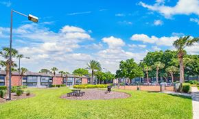 Altamonte Springs apartment for rent - the preserve at ballantyne commons apartments clubhouse with grass and trees