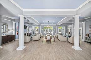 Charleston apartment for rent - a dining room with white pillars and a table with chairs