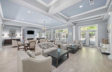 Charleston apartment for rent - a living room with couches and chairs and a table