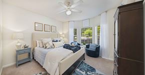 Charleston apartment for rent - a bedroom with a bed and a ceiling fan
