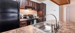 Charleston apartment for rent - a kitchen with black appliances and granite counter tops