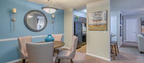 Charleston apartment for rent - a dining room with a table and chairs and a mirror