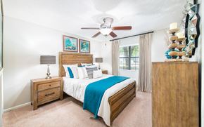 Goose Creek apartment for rent - a bedroom with a bed and a ceiling fan