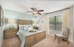 Summerville apartment for rent - a bedroom with a bed and a ceiling fan