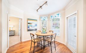 Summerville apartment for rent - a dining room with a table and chairs and two windows