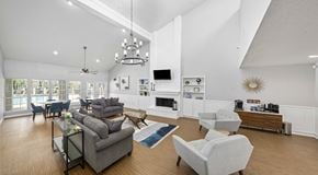 Jacksonville apartment for rent - A modern living room with a fireplace and a television.