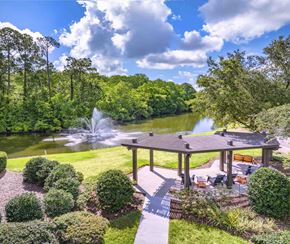 Jacksonville apartment for rent - a backyard with a pond and a gazebo and a fountain