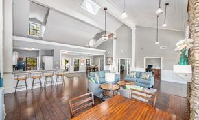 Tallahassee apartment for rent - the living room and dining area of a house with high ceilings