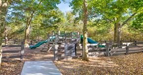 Jacksonville apartment for rent - A playground with a slide and a signboard.