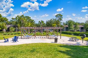 Jacksonville apartment for rent - a picnic area with hammocks and chairs in a park