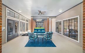 Savannah apartment for rent - a dining room with a table and chairs and a ceiling fan