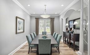 Charlotte apartment for rent - A dining room with a long table and chairs.