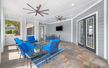 Charlotte apartment for rent - a living room with blue chairs and a glass table