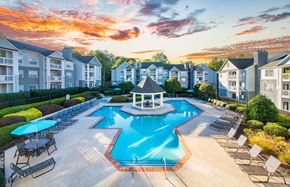 Charlotte apartment for rent - an aerial view of a swimming pool with chairs and umbrellas at the resort