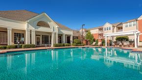 Charlotte apartment for rent - a large swimming pool with apartments in the background