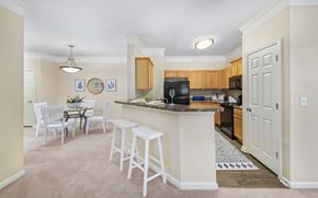 Cornelius apartment for rent - A kitchen with a bar area and a dining table.