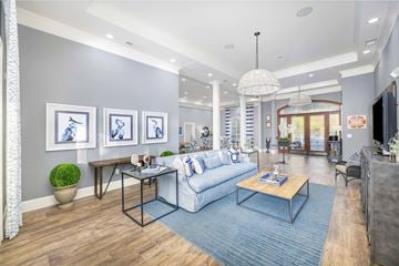 Cornelius apartment for rent - A living room with a white sofa and a blue rug.