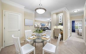 Cornelius apartment for rent - A dining room with a glass table and white chairs.