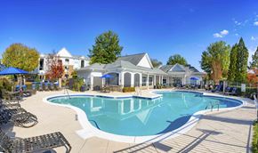 Cornelius apartment for rent - A large swimming pool with a building in the background.