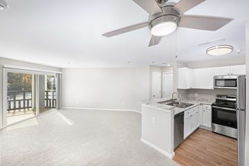 Midlothian apartment for rent - A spacious kitchen with white cabinets and a large island.