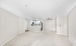 Midlothian apartment for rent - A spacious empty room with a fan and a window.