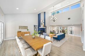 Hampton apartment for rent - A dining room with a wooden table and chairs.