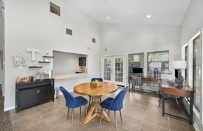 Hampton apartment for rent - a dining room with a table and chairs and a kitchen with a counter and a