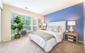 Matthews apartment for rent - a bedroom with a large bed and a window