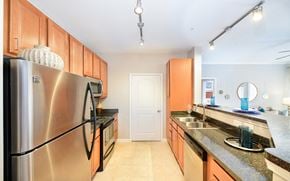 Matthews apartment for rent - a kitchen with stainless steel appliances and granite counter tops
