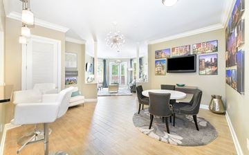 Charlotte apartment for rent - a living room with a table and chairs and a television