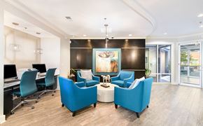 Charlotte apartment for rent - a conference room with blue chairs and a table