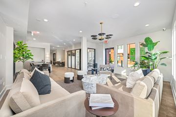 Charlotte apartment for rent - A living room with a beige couch and a coffee table.