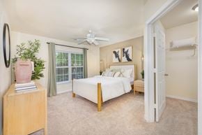 Morrisville apartment for rent - a bedroom with a bed and a ceiling fan